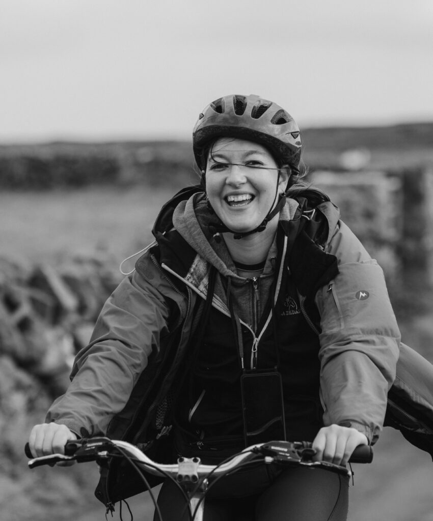 Woman Cyclist on Bike Smiling B&W Photograph